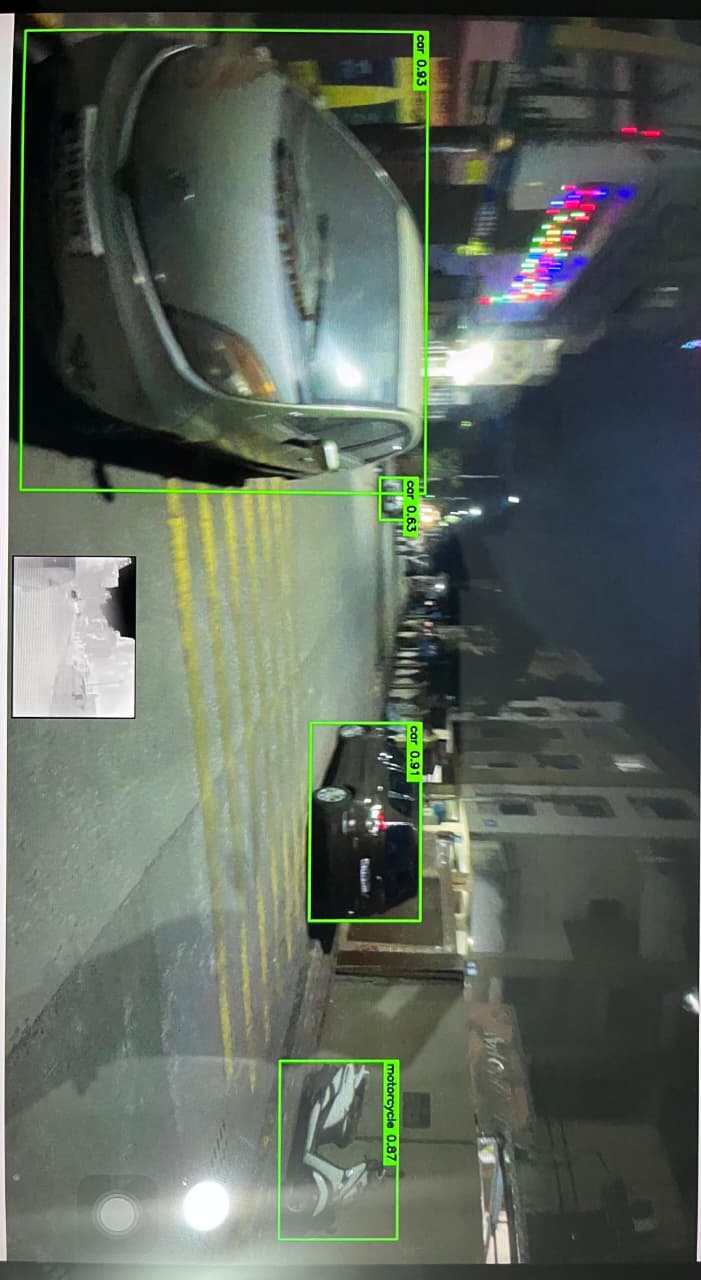 HAWKAI AI identifying cars and a motorcycle on a street.